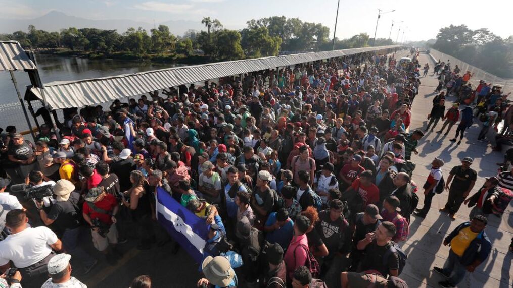 Thousands of migrants congregate under US-Mexico border bridge