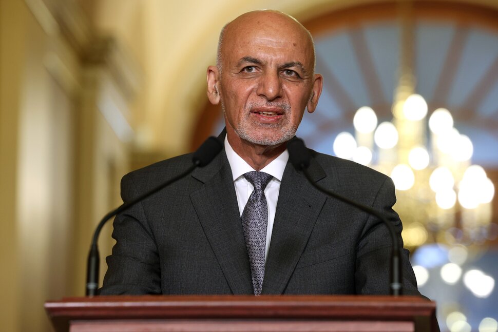 Former Afghan president defends escaping the country